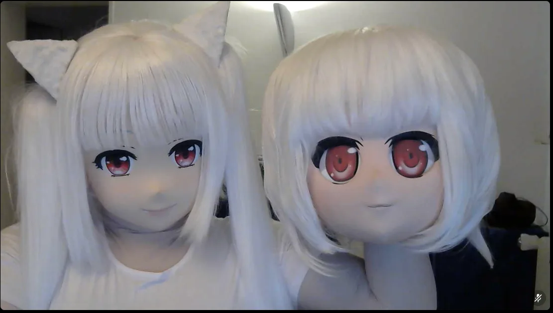 Side-by-side comparison of a Kyuubey from Madoka Magica worn on the left and an RTPS mask held on the right