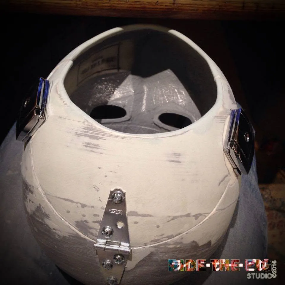 Interior and hinge hardware of an unfinished Ride the Pig Studio mask shell, 2016
